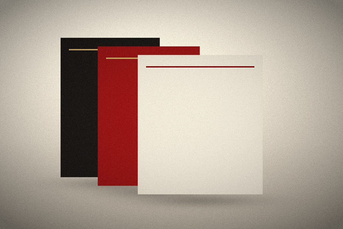 Stacked custom poster boards in black, brick, and cream